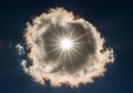 Features a bright sun obscured by a circular cloud formation Royalty Free Stock Photo