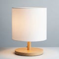 It features a cylindrical white fabric lampshade that diffuses light gently Royalty Free Stock Photo