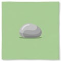 Features a single, smooth grey stone centered on a light green Royalty Free Stock Photo