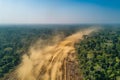 Featuring a aerial view of a deforested area in the amazon rainforest, with trees being cut down and sand flying around. the scen Royalty Free Stock Photo