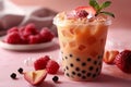 Featuring boba tea with red fruit and ice cubes in a plastic cup isolated on a pink background, in a front view. fresh bubble Royalty Free Stock Photo