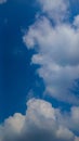featuring a bright blue sky filled with large, fluffy white clouds Royalty Free Stock Photo