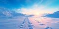 featuring fresh ski tracks on a snowy slope at sunrise, with warm oranges and cool blues blending in the sky. Royalty Free Stock Photo