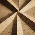 Featuring intersecting folded tan paper, creating a star-like Royalty Free Stock Photo