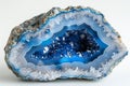Featuring photo of a blue agate geode slice on white background, isolated with clear edge definition Royalty Free Stock Photo