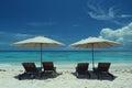 Featuring a two chairs on a sandy beach under an umbrella, high quality, high resolution Royalty Free Stock Photo