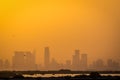 Feb 23, 2018: Abu Dhabi City Skyscrapers Covered with Orange dust (Smog) at Dusk (UAE)