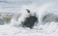 Amazing shot of a professional surfer surfing in the sea with big waves in summer