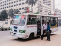 Bangladesh people on public bus in Dhaka city busy street