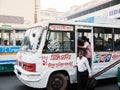 Bangladesh people on public bus in Dhaka city busy street