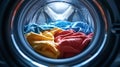 Inside the Wash: Colorful Clothes in a Washing Machine Drum Royalty Free Stock Photo