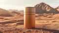 Metallic Cylindrical Container in Desert Landscape with Mountain Backdrop Royalty Free Stock Photo