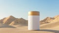 White and Gold Cylindrical Container in Sandy Desert Setting Royalty Free Stock Photo