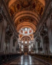 Feb 4, 2020 - Salzburg, Austria: Wide ange view of nave passage hall and altar under dome inside Salzburg Cathedral Royalty Free Stock Photo