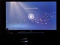 Feb 2021, UK - Sony Playstation 5 PS5 Console TV screen with loading start screen blue particles