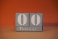 0 Februar on wooden grey cubes. Funny calendar date 00 February. Concept of date. Copy space for text