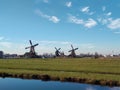 traditional windmills typical of zaanse schans in holland. Royalty Free Stock Photo