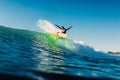 February 15, 2022. Brazil, Florianopolis. Woman during surfing with morning light