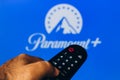 February 21, 2022, Brazil. In this photo illustration a close-up of a hand holding a TV remote control seen displayed in front of