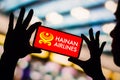 February 4, 2023, Brazil. In this photo illustration, the Hainan Airlines logo is displayed on a smartphone screen