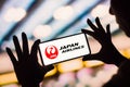 February 4, 2023, Brazil. In this photo illustration, the Japan Airlines logo is displayed on a smartphone screen