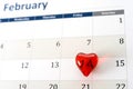 February calendar page and little red heart marking valentines day