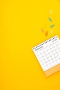 February 2024 desk calendar and paper clips on yellow color background Royalty Free Stock Photo