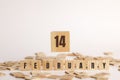 February 14 displayed wooden letter blocks on white background