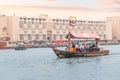 Abra Dhow wooden boat by RTA transport passengers wearing face masks from one bank of the Dubai Royalty Free Stock Photo