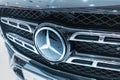 Close-up of the logo and emblem of the Mercedes-Benz carmaker on a black car Royalty Free Stock Photo