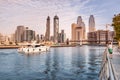 Luxury yacht or boat sails by Dubai Creek Canal at Downtown Center with stunning views of numerous