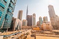 numerous construction sites and car parking around the famous tallest skyscraper - Burj Khalifa