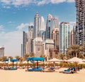 Plenty of sun loungers and umbrellas on the beach in the JBR area against the backdrop of