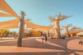 Visitors and tourists with families and children near famous Baobab trees in African Village at