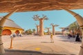 Visitors and tourists with families and children near famous Baobab trees in African Village at