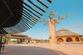 Visitors and tourists with families and children near famous Baobab trees in African Village at