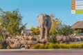 Zebra, elephant and crocodile statues on an artificial fountain and waterfall in the central safari