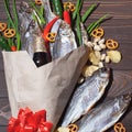 February 23. Gift for men. A bouquet of dry fish, chips, pistachios, green onions, chili peppers. Decorated with a red bow. Men`s Royalty Free Stock Photo