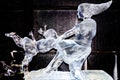 February 2013 - Harbin, China - woman dancing with child ice statue