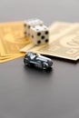 February 8, 2015: Houston, TX, USA. Monopoly car, dice and mone Royalty Free Stock Photo