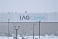 IAGCargo sign on building exterior and parking lot in snowfall