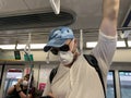 One Caucasian white Young boy on the train,wearing medical face mask