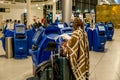 February 18, 2019. Kastrup Airport Denmark Copenhagen. Woman backs unrecognizable with large suitcases baggage independently