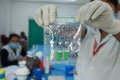 February 20,2021, Kishanganj, Bihar, India. Nursing staff holding used empty vials of Covishield vaccine with gloved Royalty Free Stock Photo