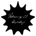 February 29 is leap day. A blot with an inscription inside. Black spot with silver italic