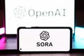 Openai Sora logo is displayed on a smartphone screen. OpenAI announced Sora artificial intelligence, which transforms