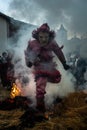 Mascaraed People jumping cross bonfires in an ancient tradition of Carnival in Vila Boa de OusilhÃ£o. Royalty Free Stock Photo