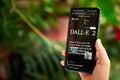 February 5, 2023, Mirissa, Sri Lanka. Using OpenAI DALL-E on phone. Woman testing artificial intelligence image