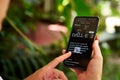 February 5, 2023, Mirissa, Sri Lanka. Using OpenAI DALL-E on phone. Woman testing artificial intelligence image