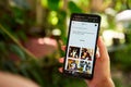 February 5, 2023, Mirissa, Sri Lanka. Using OpenAI DALL-E on phone. Woman testing artificial intelligence image